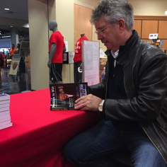Picture of Dewayne Staats signing his book